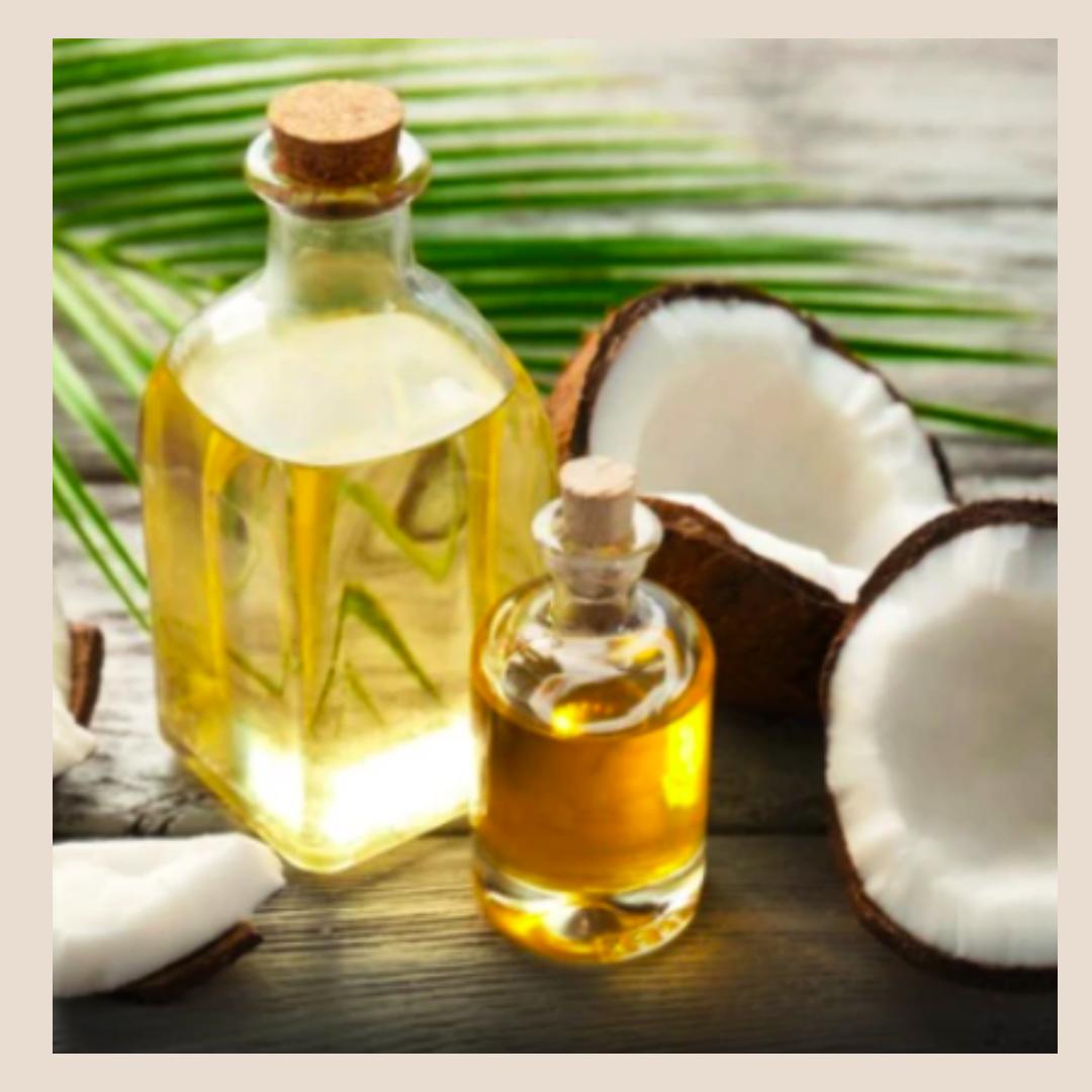 A bottle of coconut oil and coconut fruits