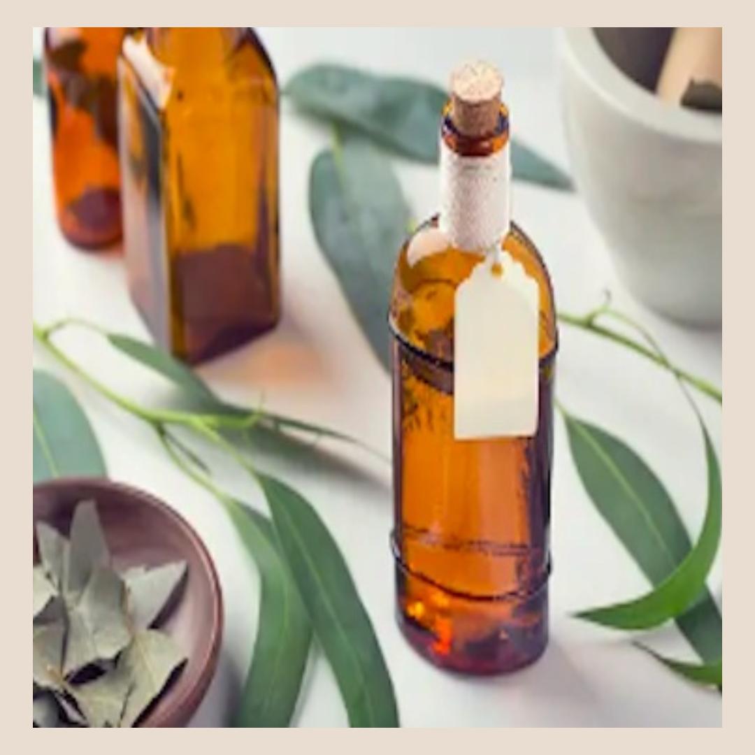 Bottles of eucalyptus oil and flowers